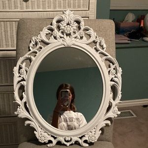 23 inch by 19 inch white mirror. Selling for $19.99. Very good condition, clean.